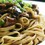 Spicy Dan Dan Noodles with Savory Mushroom-Walnut Crumble