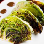Savor Grilled Cabbage Steaks Drizzled with Zesty Mustard Sauce