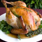 Savory Roasted Capon with Brioche Herb Stuffing Delight